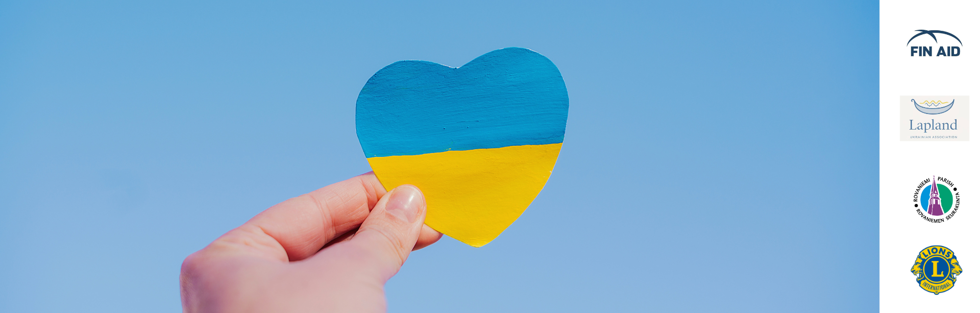 Käsi Ukrainan lipun värinen sydän