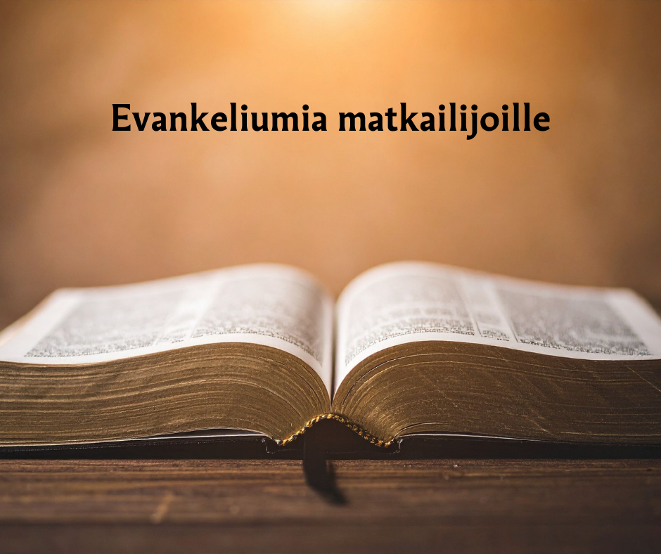 Pöydällä avoin Raamattu, takana kirkas valo